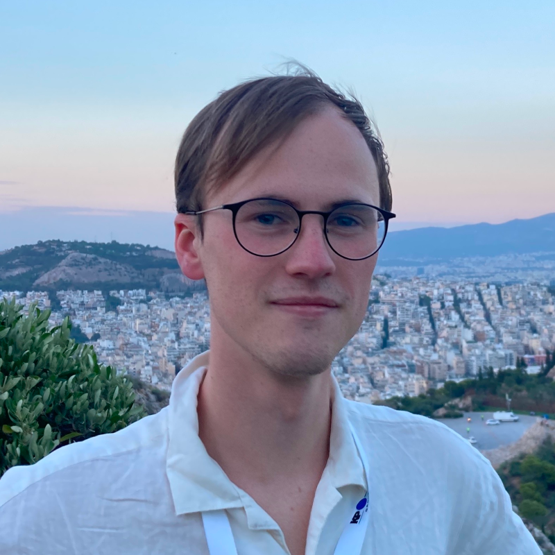 Profile Picture of Adrián Moreno (@zetxek), working side by side with a colleague: sitting on a desk, while looking at a screen